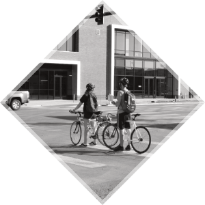 Two cyclists waiting in crosswalk